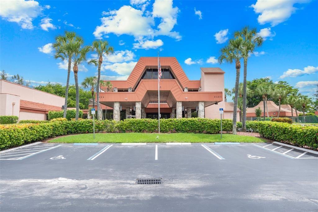 3130 Holiday Springs Boulevard, Unit 104 Margate, FL 33063 - Photo 6 of 7 a front view of a house with a yard and garage