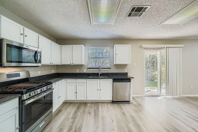 a view of livingroom with furniture wooden floor and window