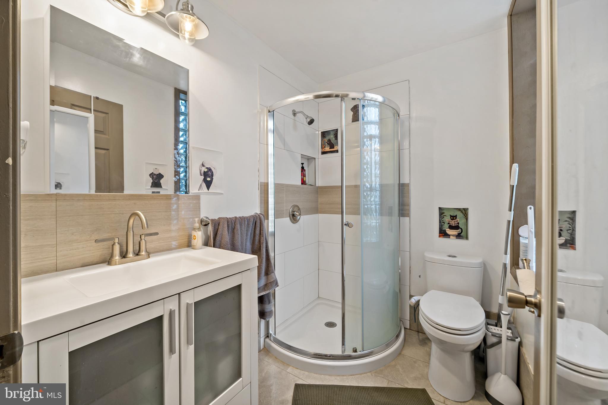 653 North 33rd Street Philadelphia, PA 19104 - Photo 11 of 28 a bathroom with a sink a toilet and shower