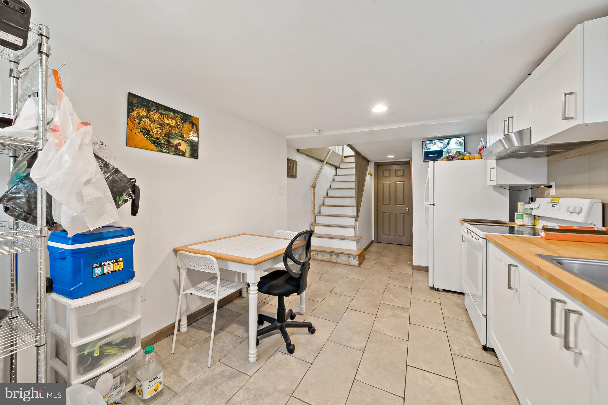 653 North 33rd Street Philadelphia, PA 19104 - Photo 12 of 28 a view of kitchen with furniture and wooden floor