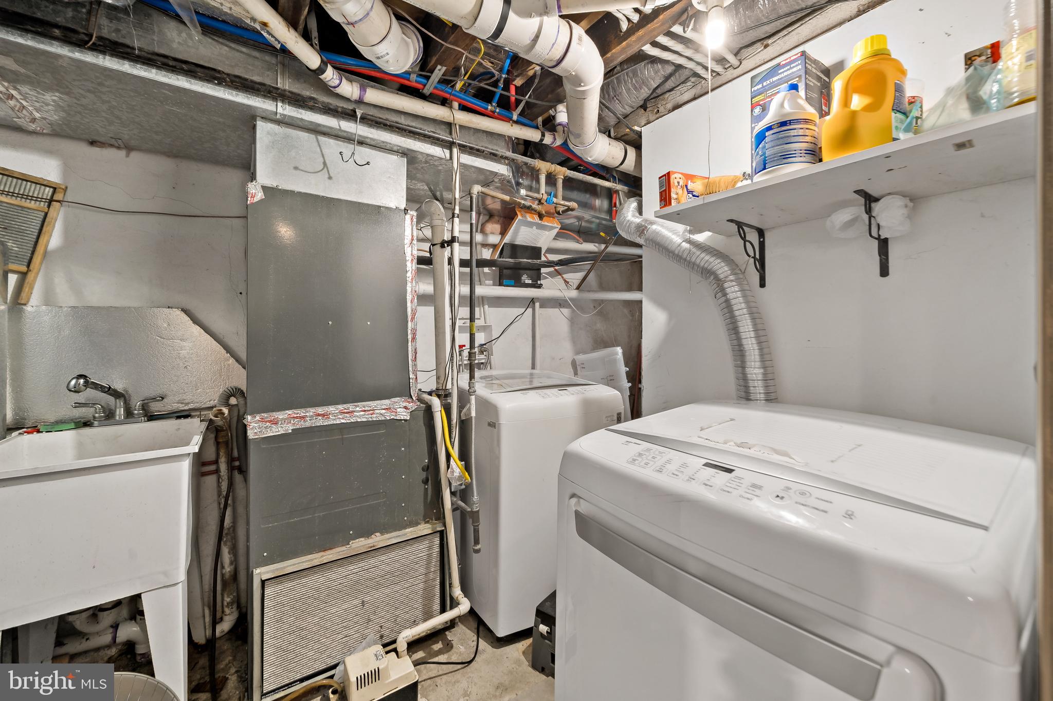 653 North 33rd Street Philadelphia, PA 19104 - Photo 14 of 28 a utility room with dryer and washer