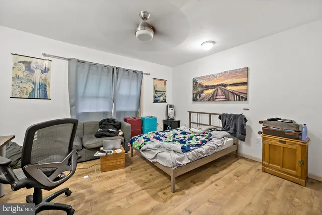 a bedroom with furniture and a bed