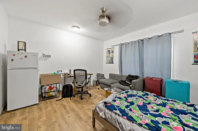 a bedroom with furniture and a baby crib