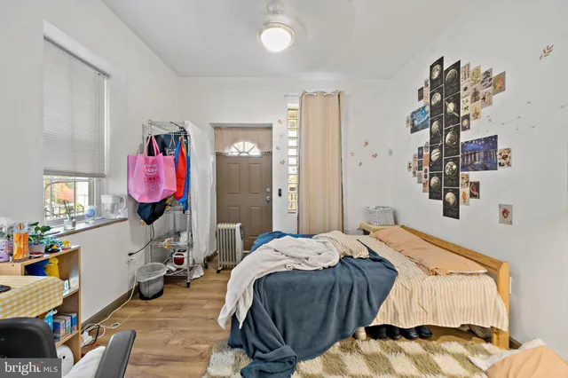 a bed room with a bed and a window