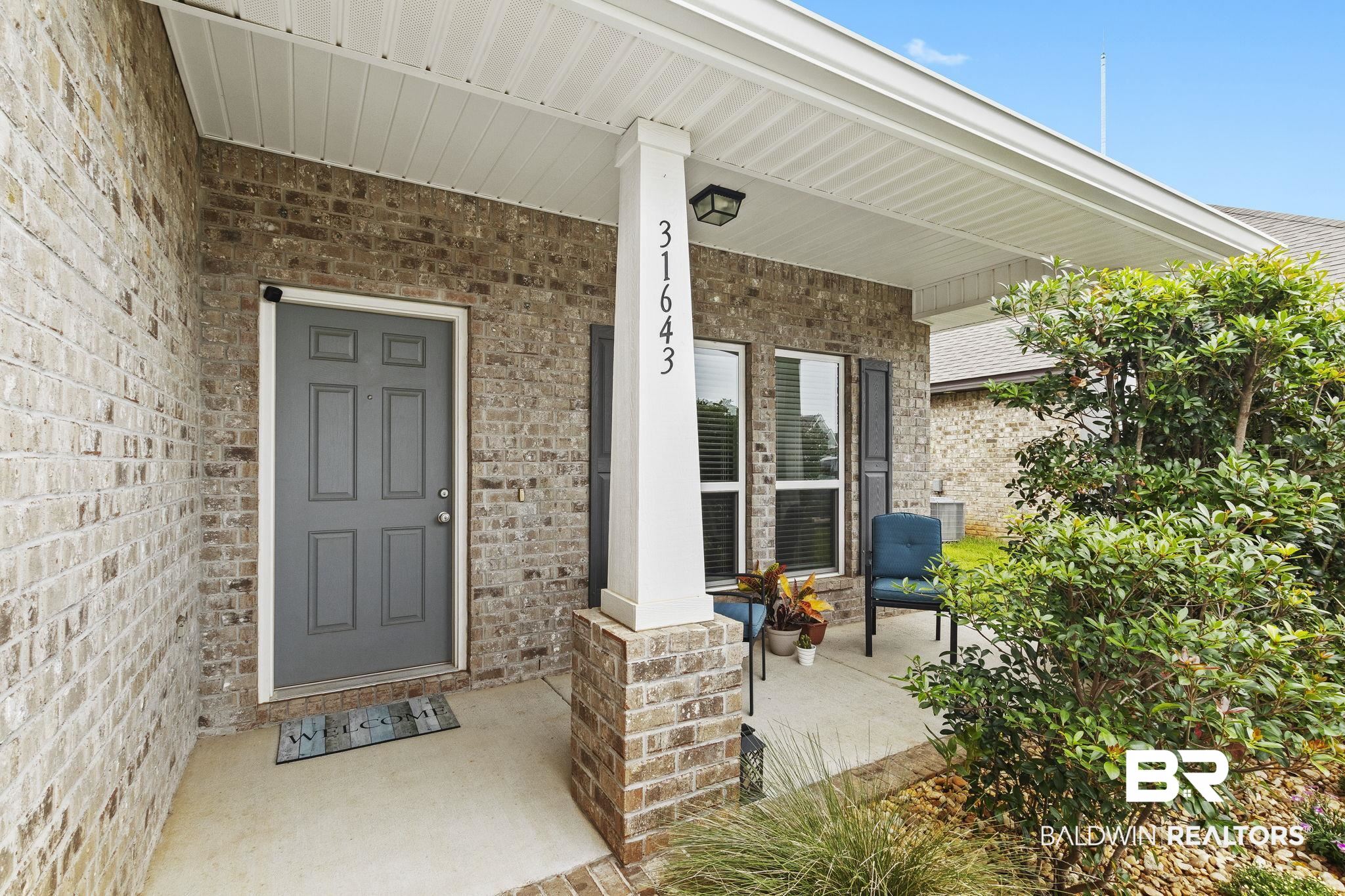 31643 Kestrel Loop Daphne, AL 36527 - Photo 3 of 59 Property entrance featuring covered porch