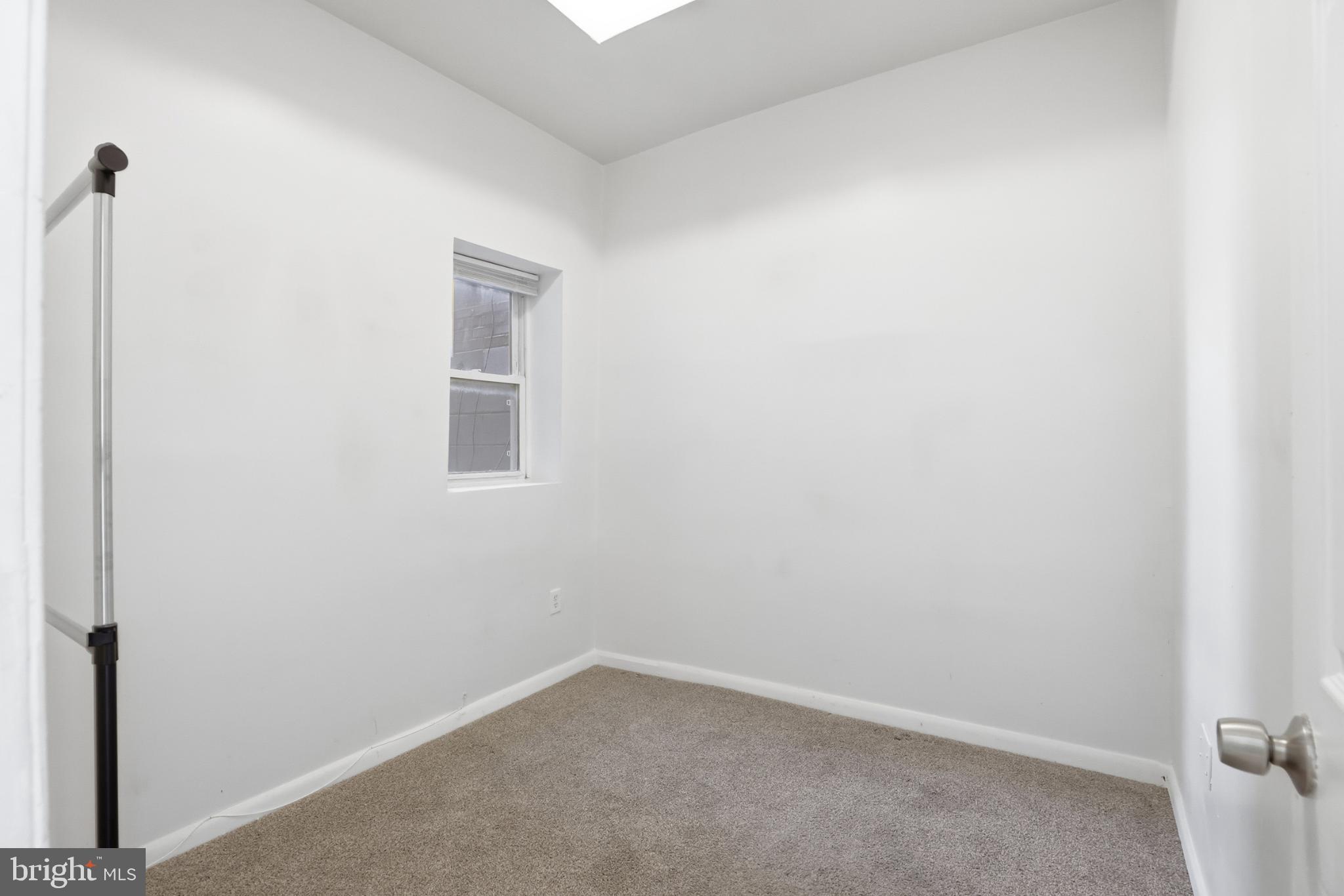 1912 9th Street Northwest, Unit 1 Washington, DC 20001 - Photo 11 of 18 a room that has a window in it
