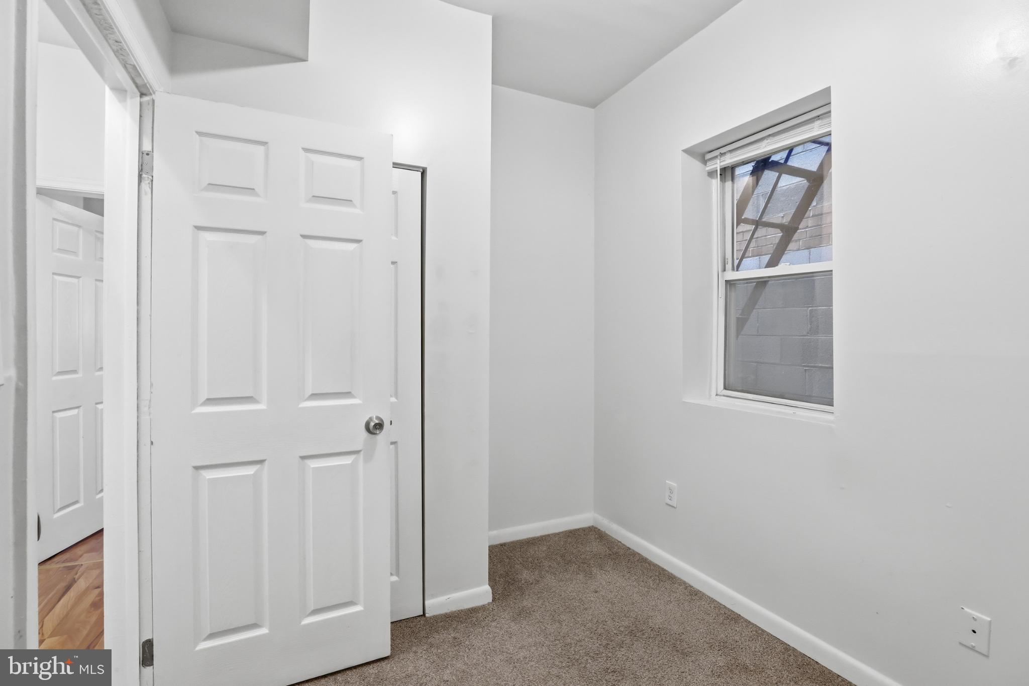 1912 9th Street Northwest, Unit 1 Washington, DC 20001 - Photo 13 of 18 an empty room with windows and closet