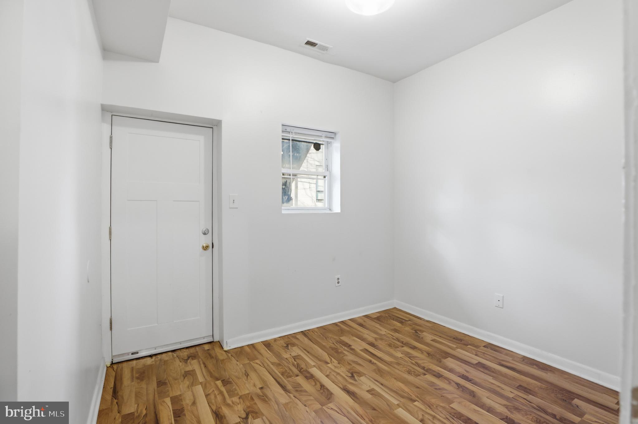 1912 9th Street Northwest, Unit 1 Washington, DC 20001 - Photo 14 of 18 a view of room with wooden floor and closet