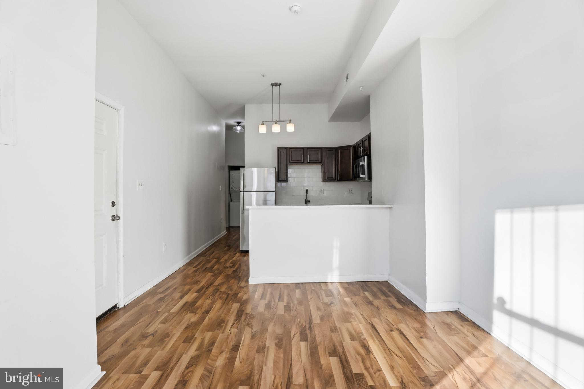 1912 9th Street Northwest, Unit 1 Washington, DC 20001 - Photo 6 of 18 a view of a kitchen from the hallway
