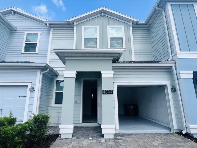 a front view of a house with a garage