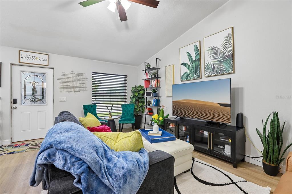 1525 Kestrel Way Brandon, FL 33511 - Photo 14 of 48 a living room with furniture and a flat screen tv