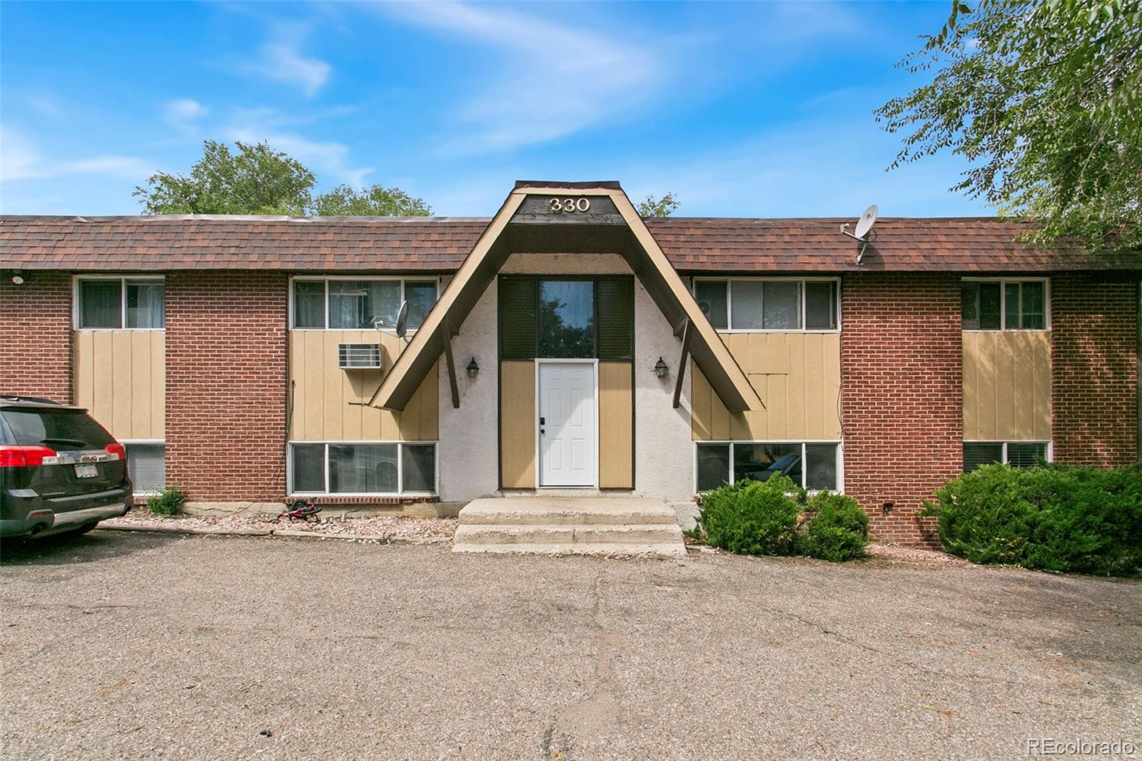 330 Vehr Drive Colorado Springs, CO 80916 - Photo 1 of 17 a view of a house with a yard