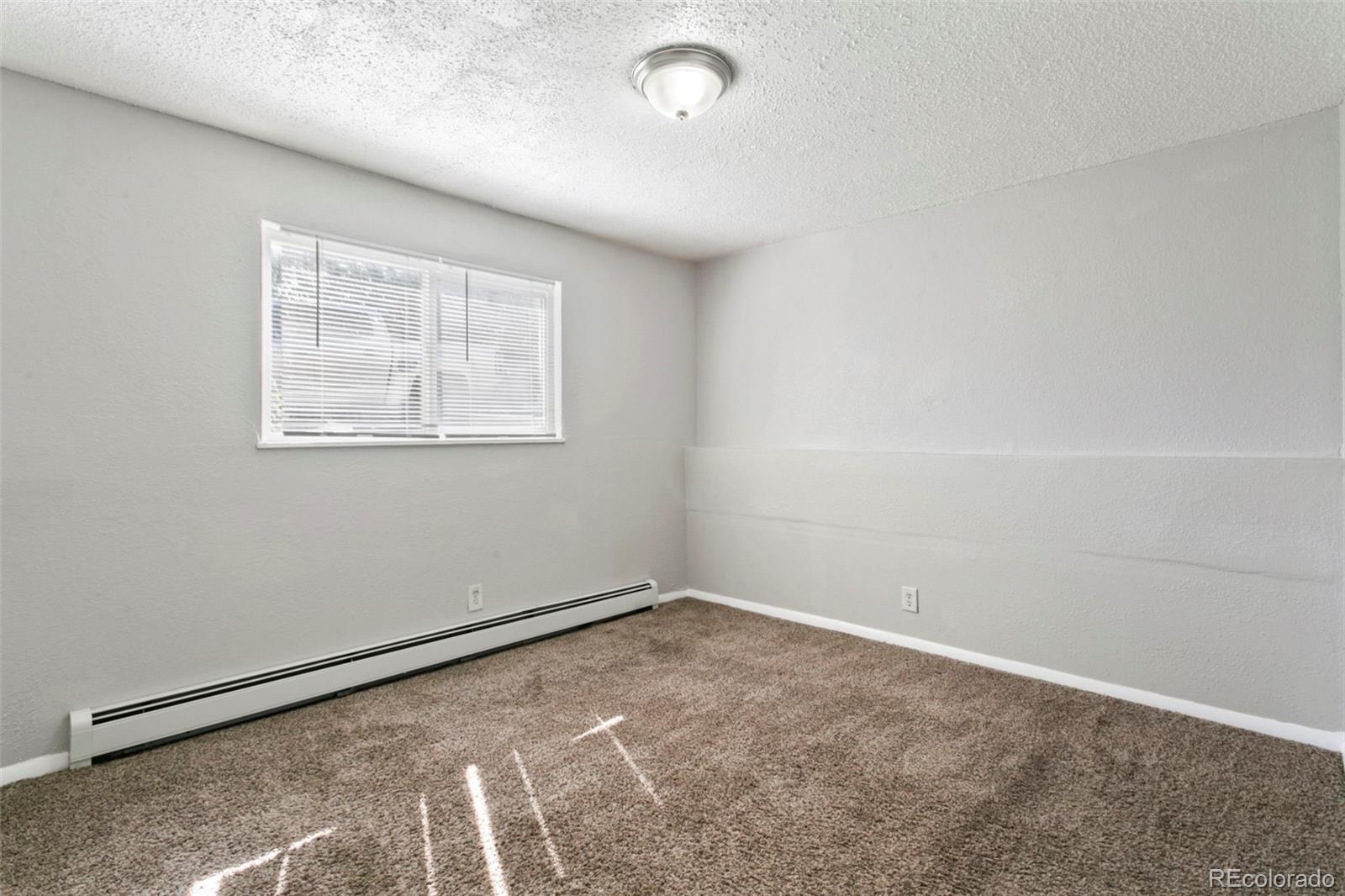 330 Vehr Drive Colorado Springs, CO 80916 - Photo 11 of 17 an empty room with windows
