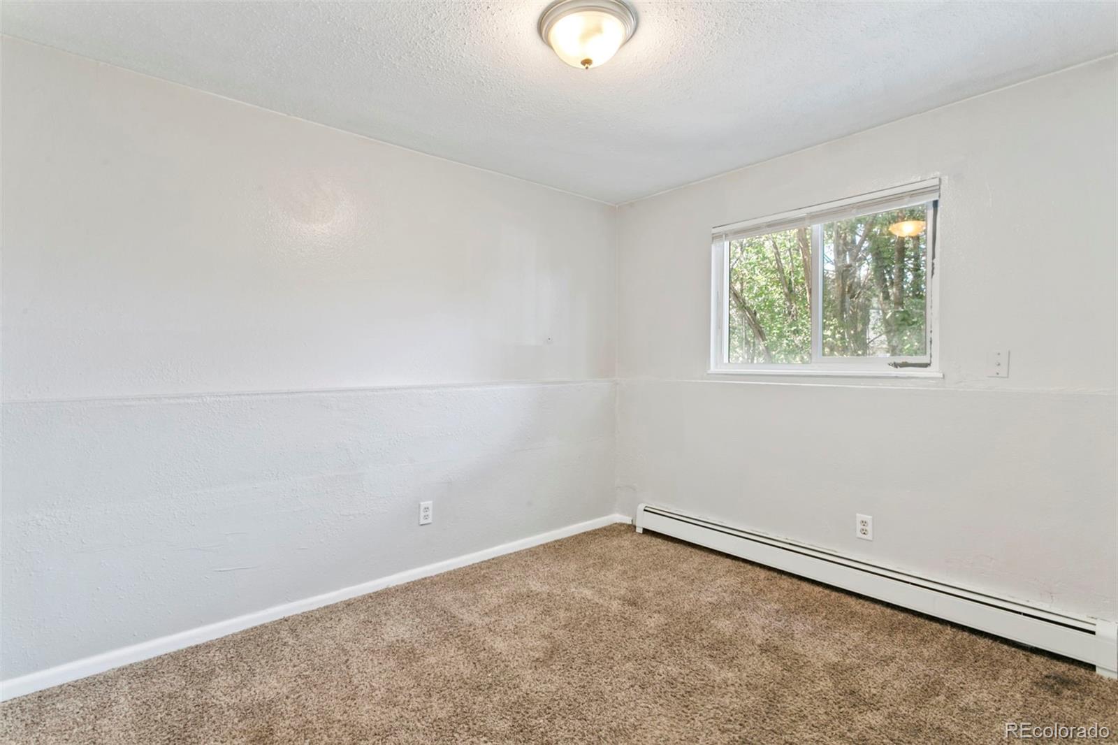 330 Vehr Drive Colorado Springs, CO 80916 - Photo 15 of 17 an empty room with a window