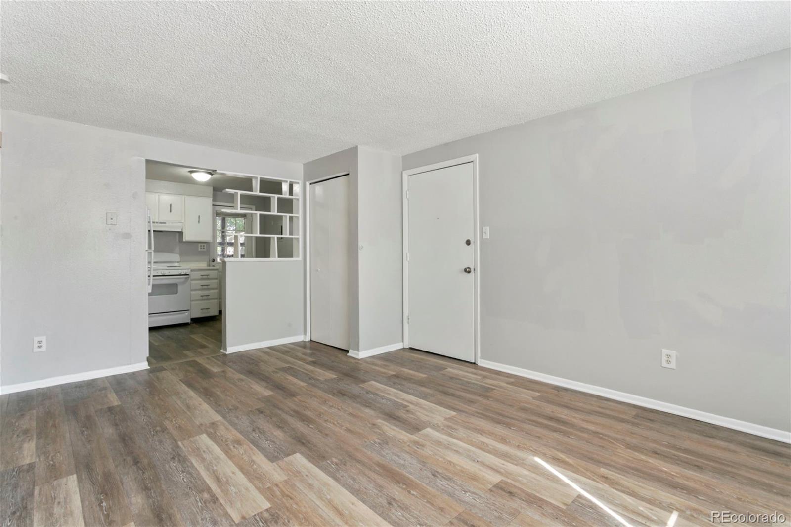 330 Vehr Drive Colorado Springs, CO 80916 - Photo 4 of 17 a view of empty room with wooden floor