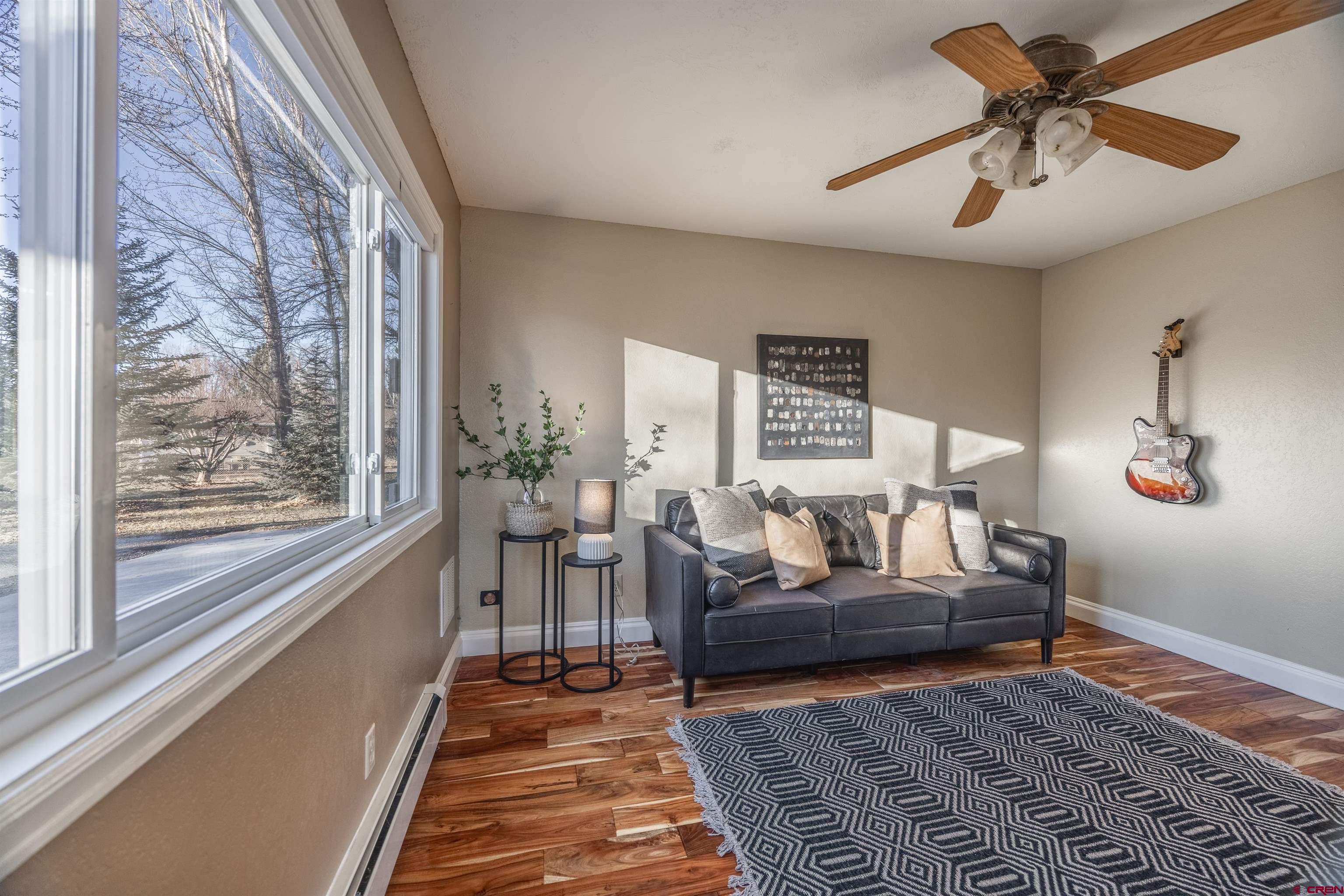 15214 6125th Road Montrose, CO 81403 - Photo 15 of 45 a living room with furniture and a rug