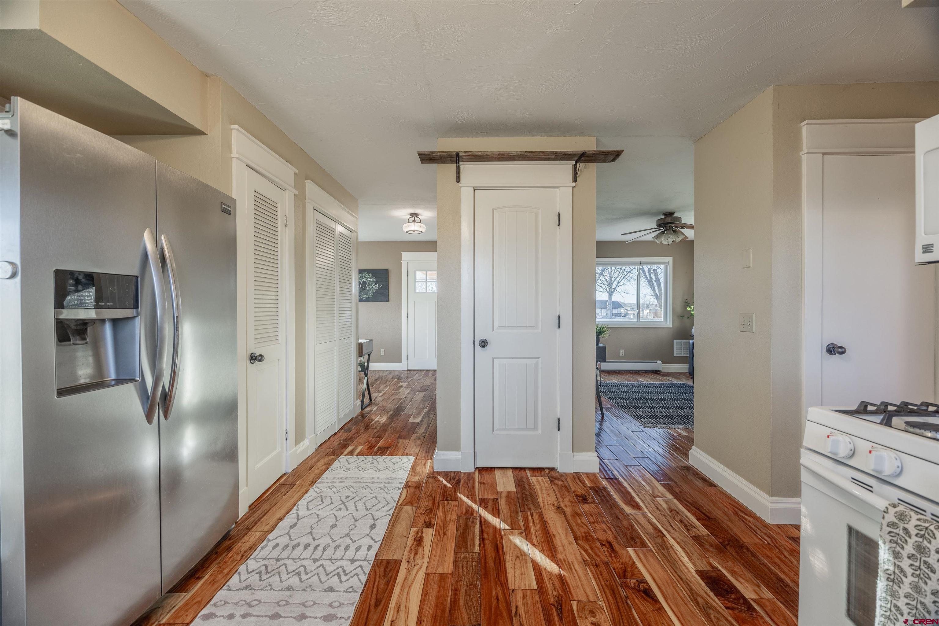 15214 6125th Road Montrose, CO 81403 - Photo 18 of 45 a walk in closet with wooden floor