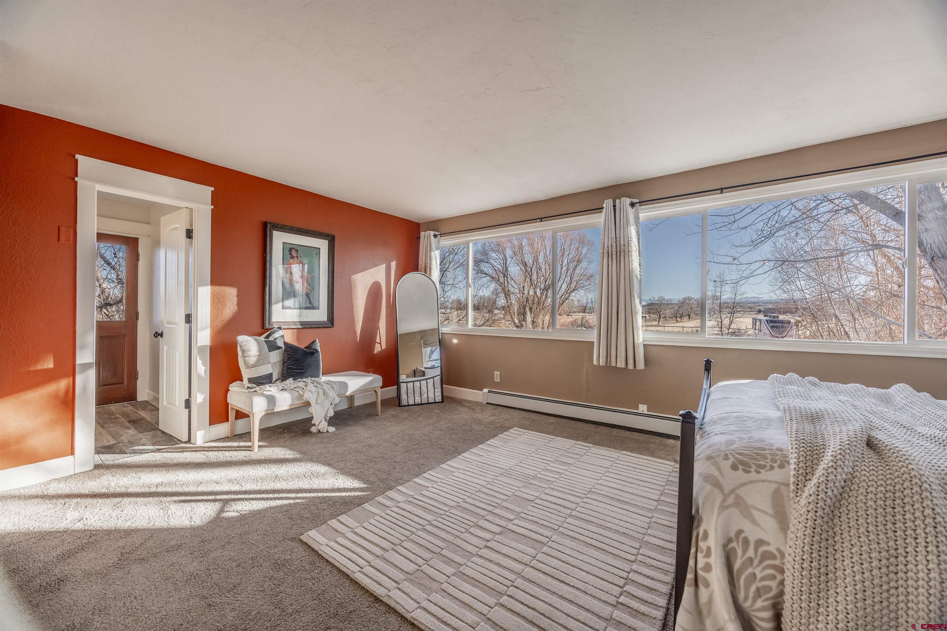 15214 6125th Road Montrose, CO 81403 - Photo 25 of 45 a living room with furniture and a large window