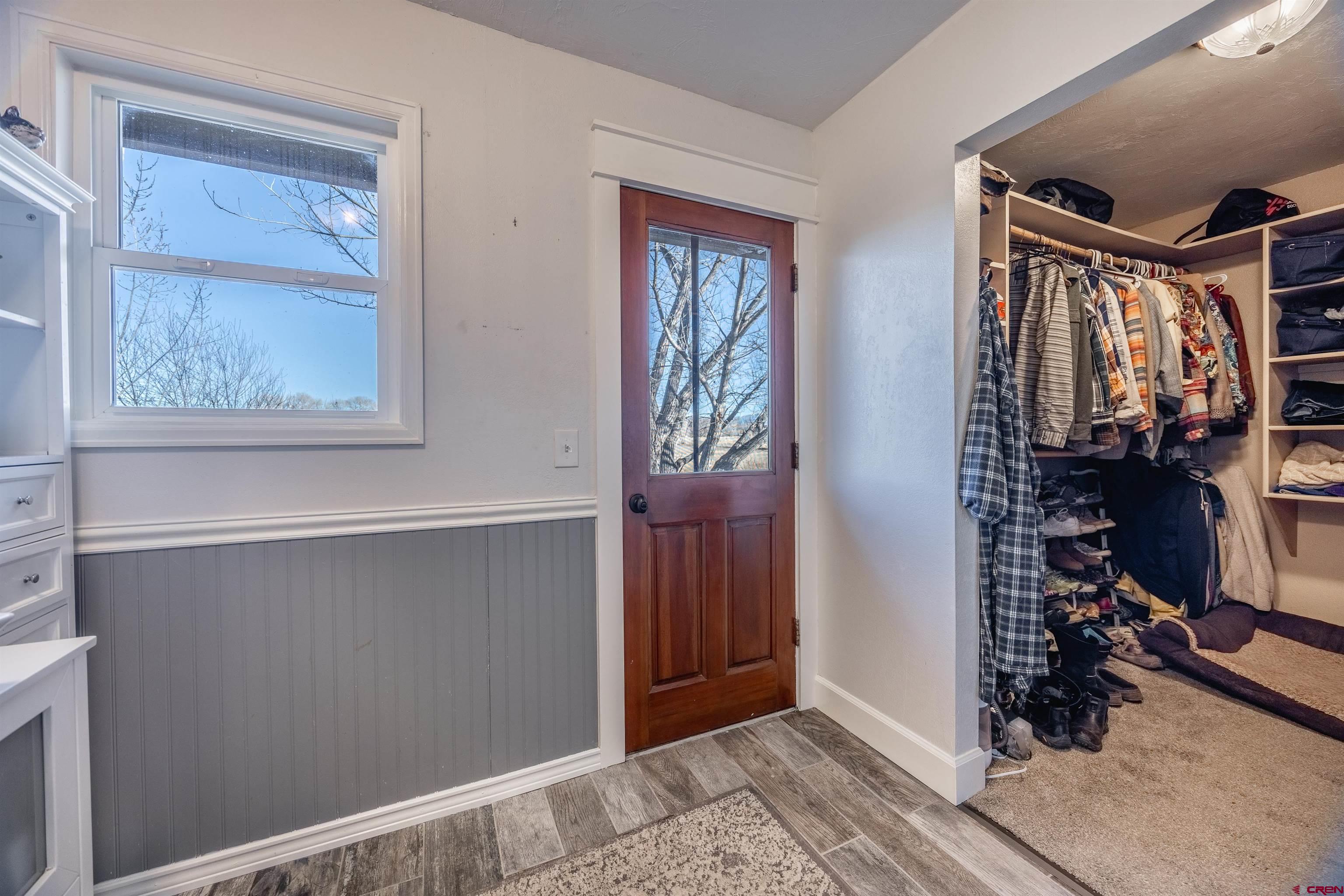 15214 6125th Road Montrose, CO 81403 - Photo 28 of 45 a view of a hallway with closet and a window