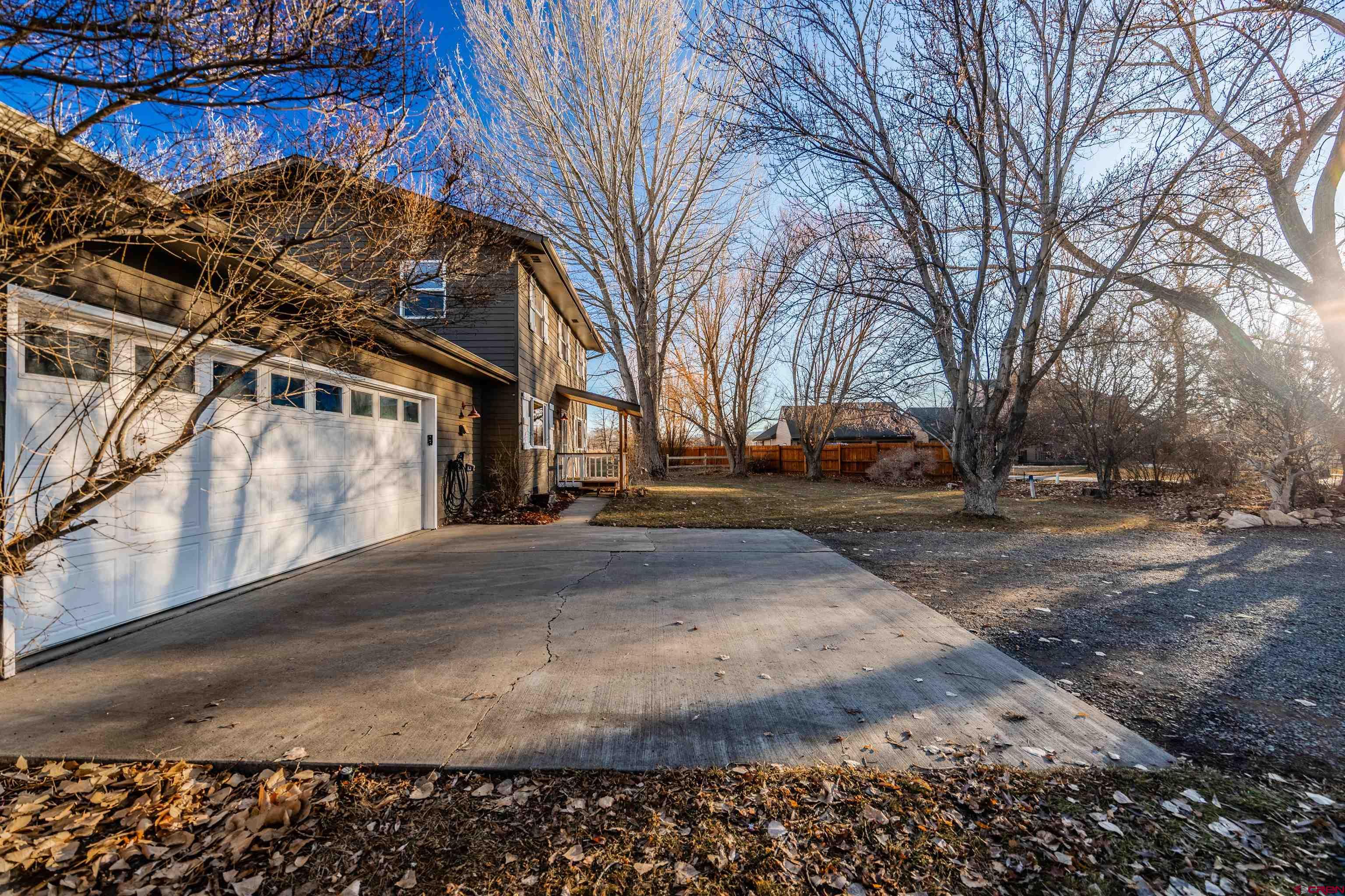 15214 6125th Road Montrose, CO 81403 - Photo 4 of 45 a view of road with large trees