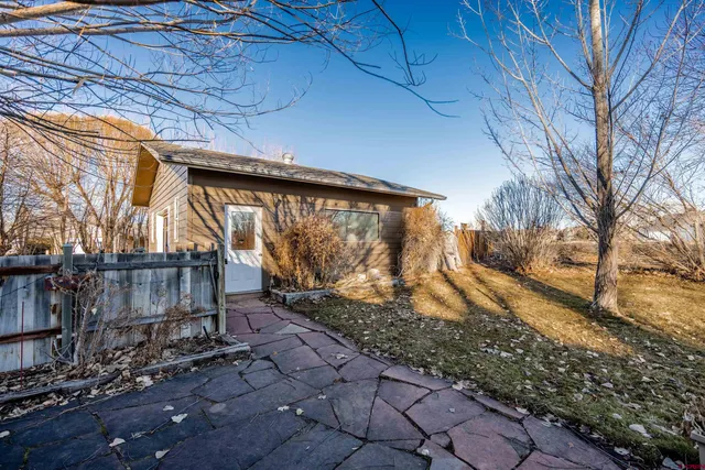 a view of a backyard of the house