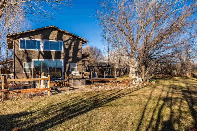 a view of a house with snow on the road