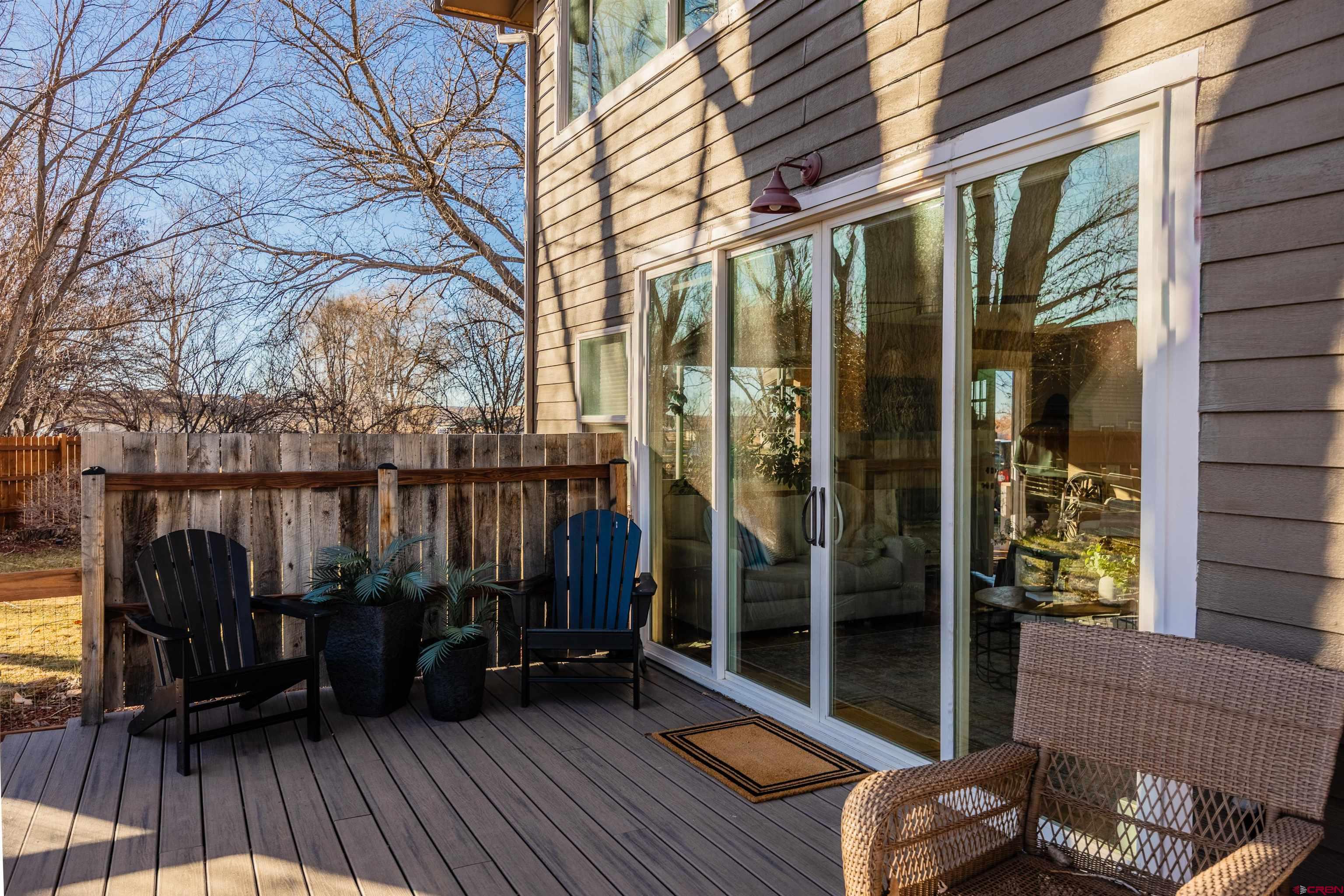 15214 6125th Road Montrose, CO 81403 - Photo 8 of 45 a view of balcony with floor to ceiling window wooden floor and outdoor seating