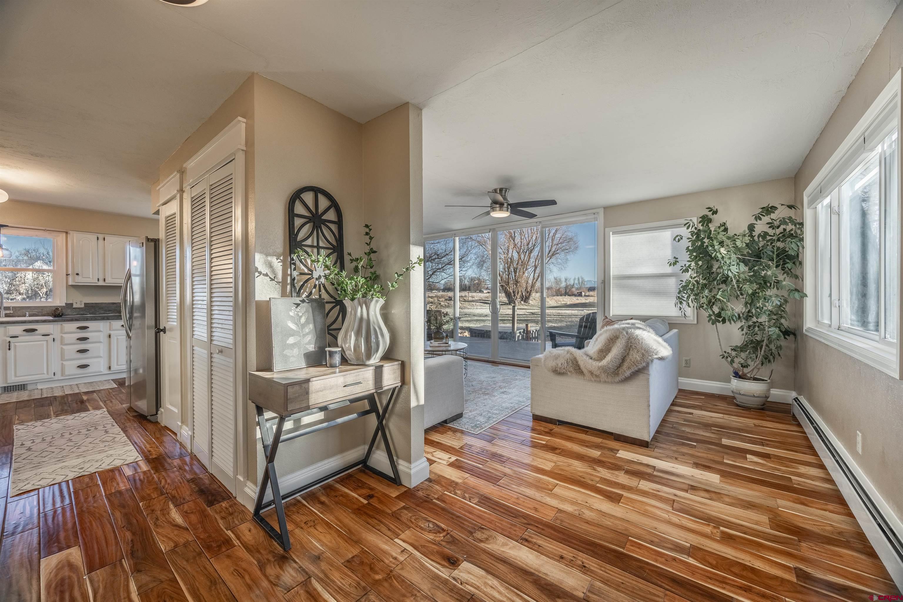 15214 6125th Road Montrose, CO 81403 - Photo 9 of 45 a living room with furniture and wooden floor