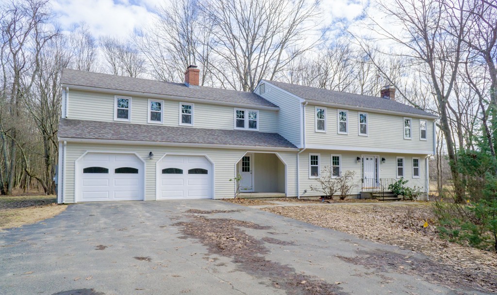 305 Old Pickard Road Concord, MA 01742 - Photo 1 of 16 a front view of a house with a yard