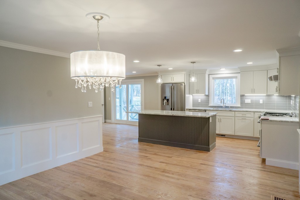 305 Old Pickard Road Concord, MA 01742 - Photo 5 of 16 a large kitchen with kitchen island a sink stainless steel appliances and cabinets