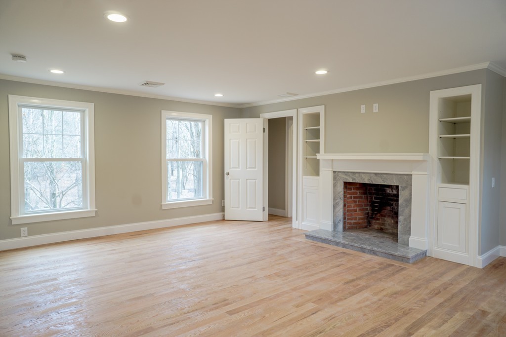 305 Old Pickard Road Concord, MA 01742 - Photo 6 of 16 an empty room with windows and fireplace