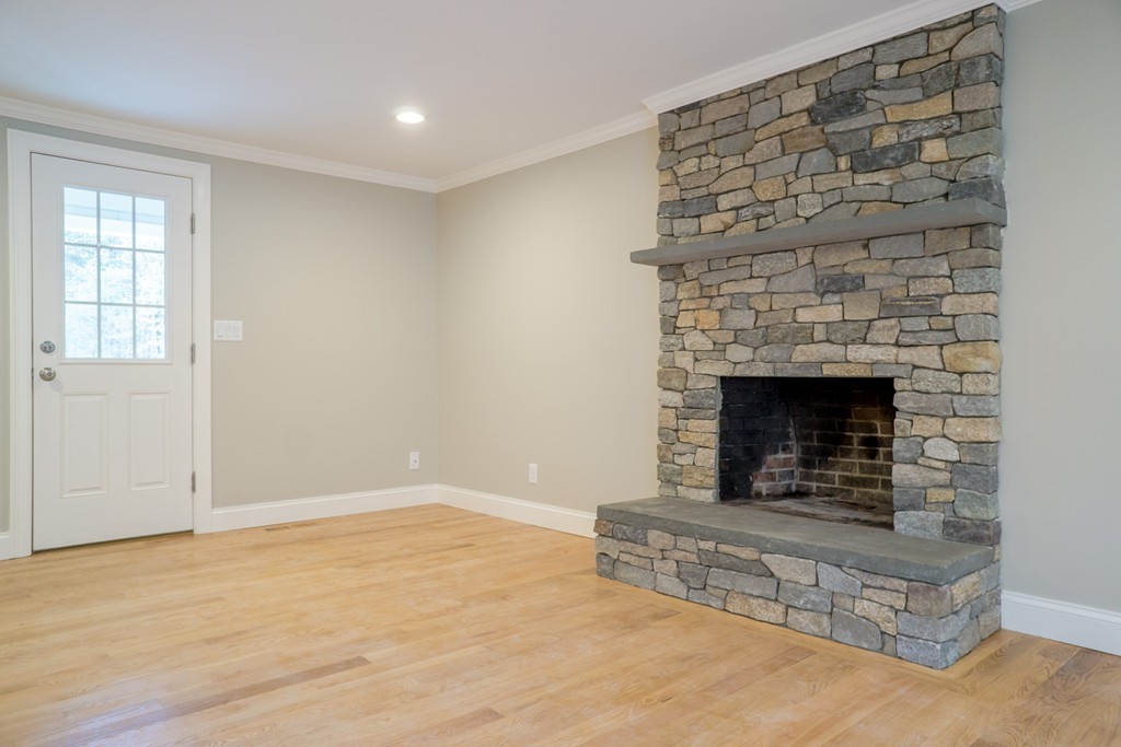 305 Old Pickard Road Concord, MA 01742 - Photo 7 of 16 an empty room with a fireplace
