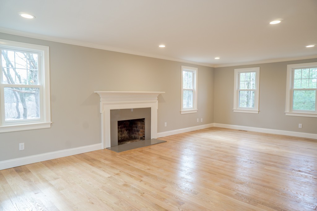 305 Old Pickard Road Concord, MA 01742 - Photo 8 of 16 an empty room with windows and a fireplace