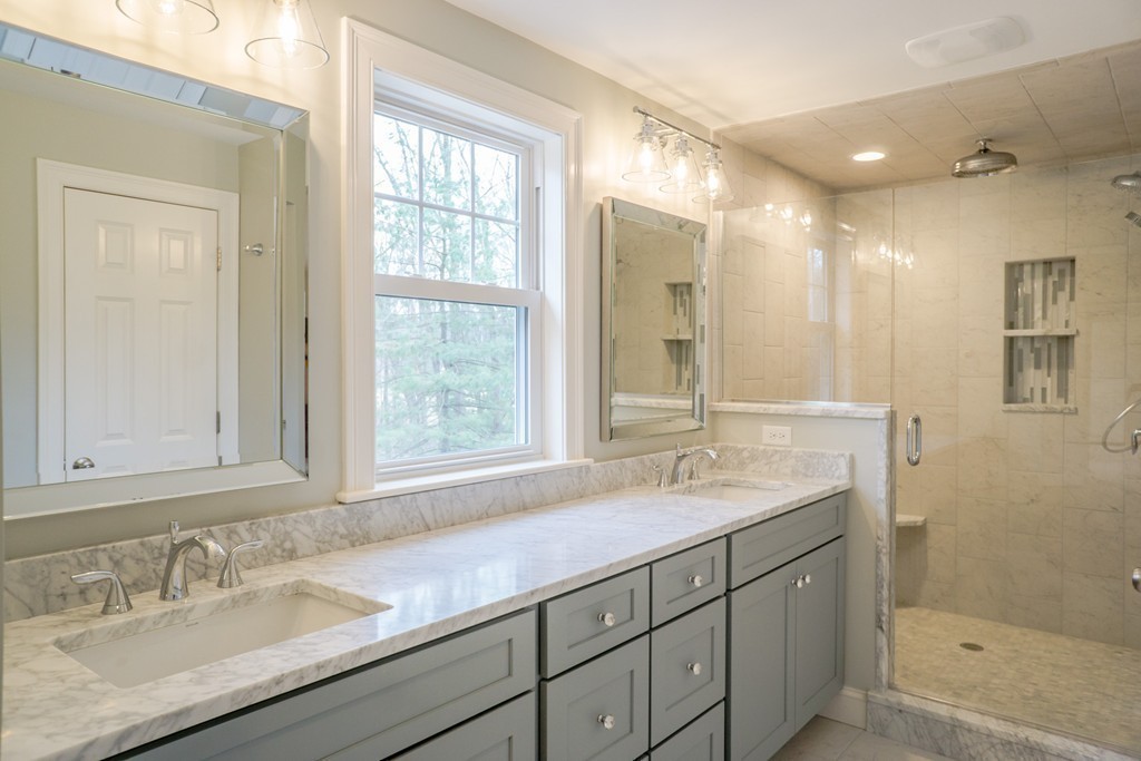305 Old Pickard Road Concord, MA 01742 - Photo 9 of 16 a bathroom with a sink double vanity and a mirror