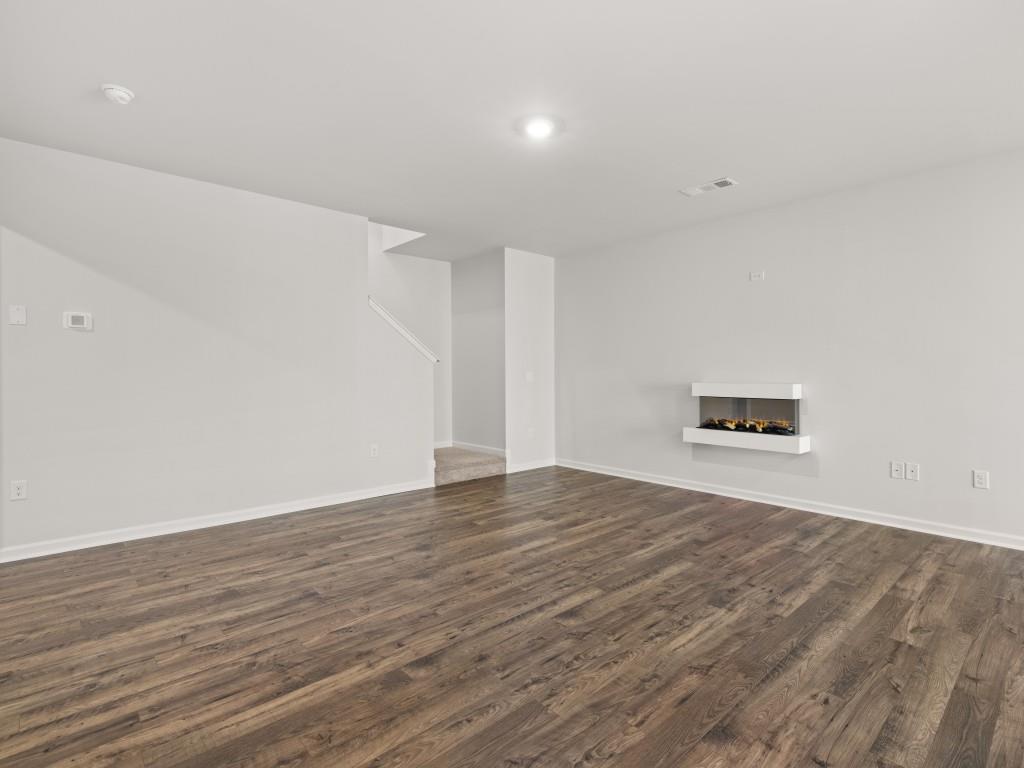 50 Rustin Ridge Dahlonega, GA 30533 - Photo 12 of 42 a view of an empty room with wooden floor and a window