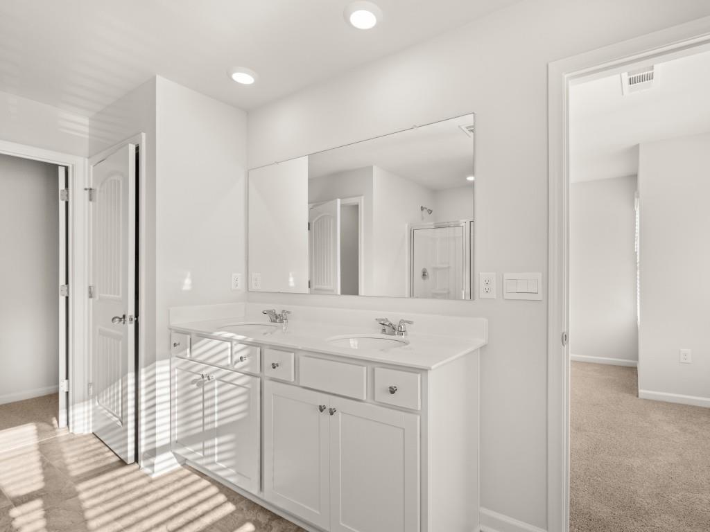 50 Rustin Ridge Dahlonega, GA 30533 - Photo 20 of 42 a spacious bathroom with a shower sink and mirror
