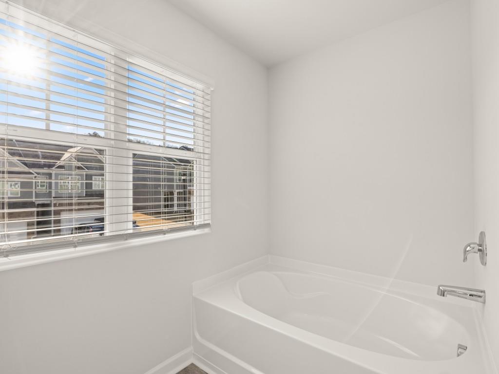 50 Rustin Ridge Dahlonega, GA 30533 - Photo 21 of 42 a white bath tub sitting next to a window
