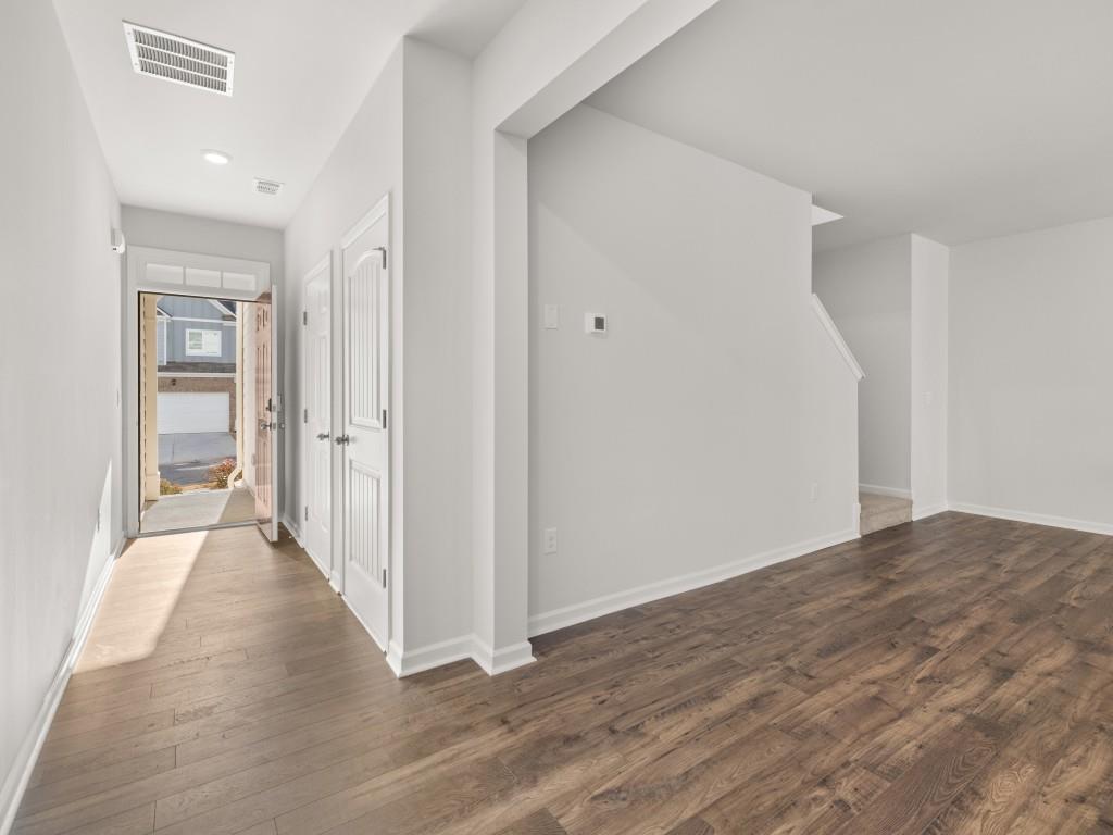 50 Rustin Ridge Dahlonega, GA 30533 - Photo 3 of 42 a view of a hallway with wooden floor and entryway