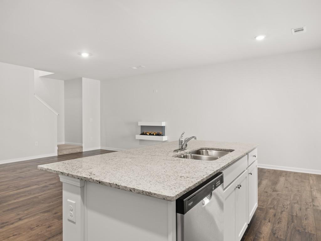 50 Rustin Ridge Dahlonega, GA 30533 - Photo 8 of 42 a utility room with granite countertop a sink and cabinets