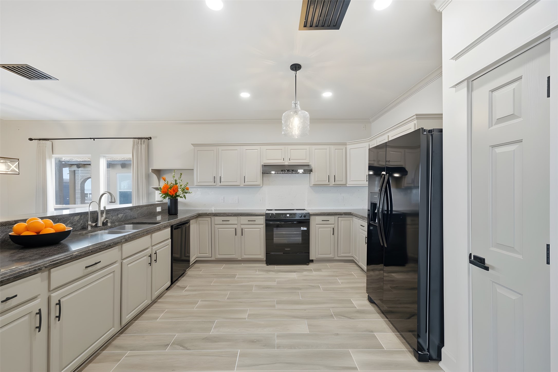 1918 Todville Road Seabrook, TX 77586 - Photo 15 of 41 The expansive second-level kitchen offers generous counter space and an open layout, creating the perfect spot for guests to gather and stay connected with the action in the adjoining living and dining areas.