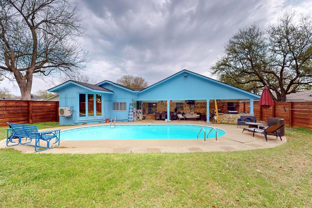 View of swimming pool with a fenced in pool, a patio area, ceiling fan, fence private yard, and a lawn