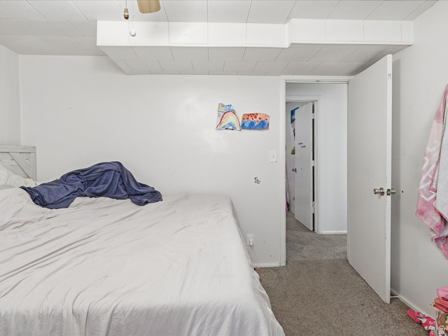 322 East 900 North Logan, UT 84321 - Photo 27 of 43 Carpeted bedroom with baseboards and a ceiling fan