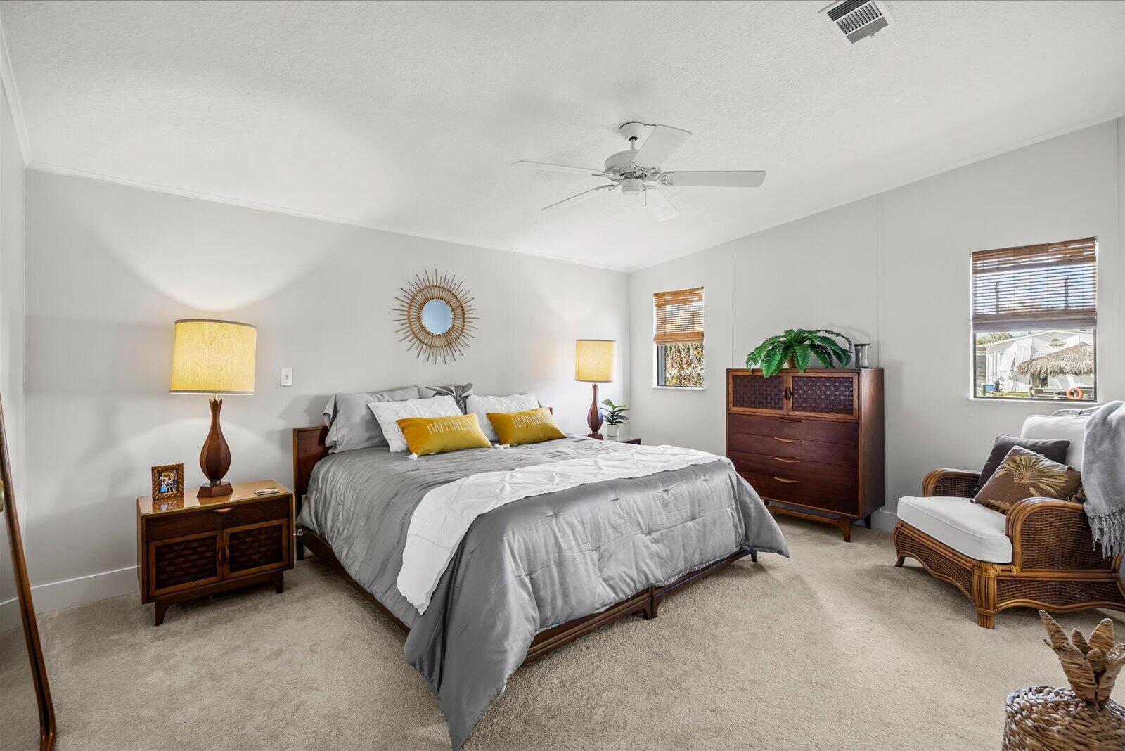 7918 Southeast Paradise Court Stuart, FL 34997 - Photo 13 of 29 a bedroom with a bed and a couch