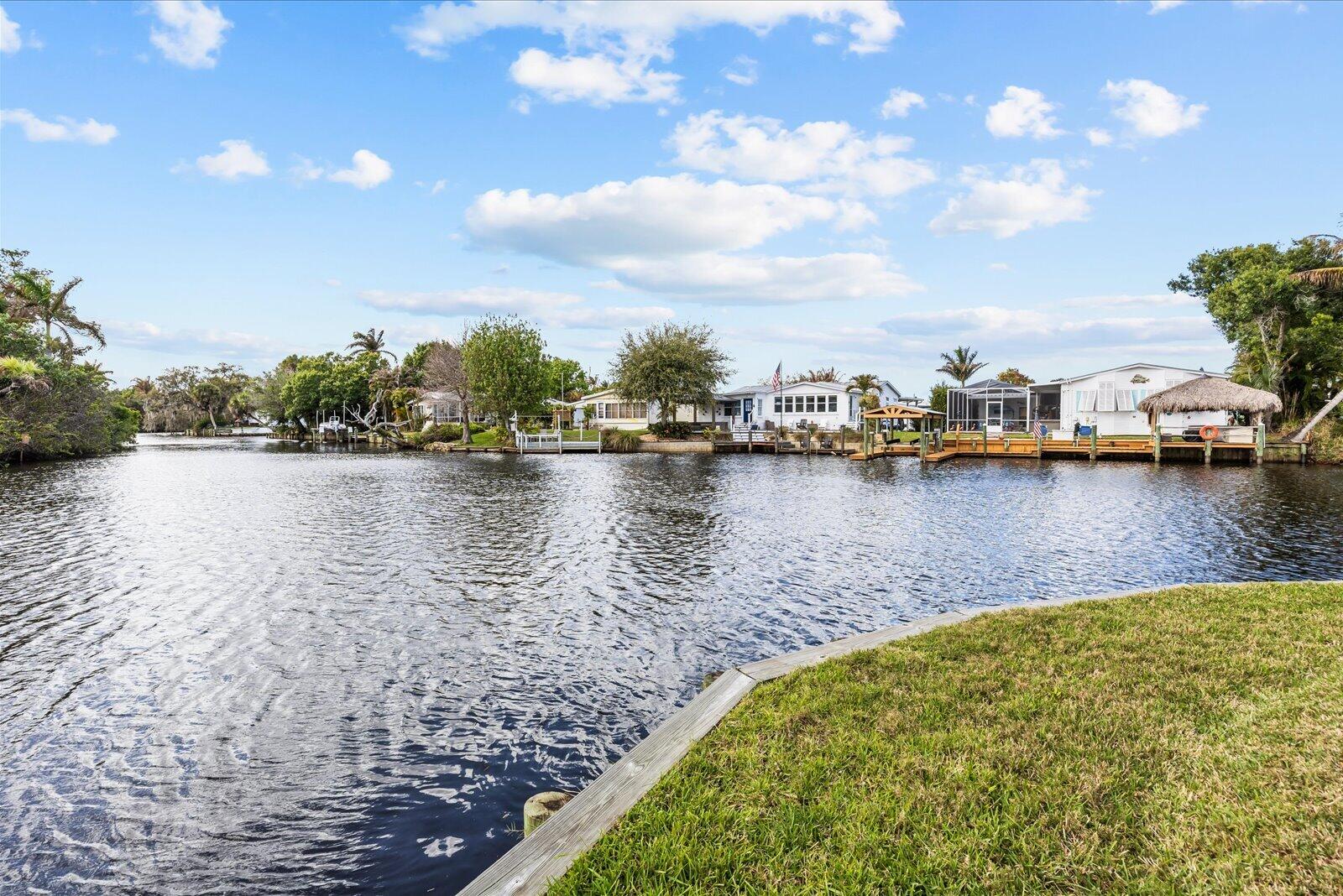 7918 Southeast Paradise Court Stuart, FL 34997 - Photo 19 of 29 a view of a lake with houses