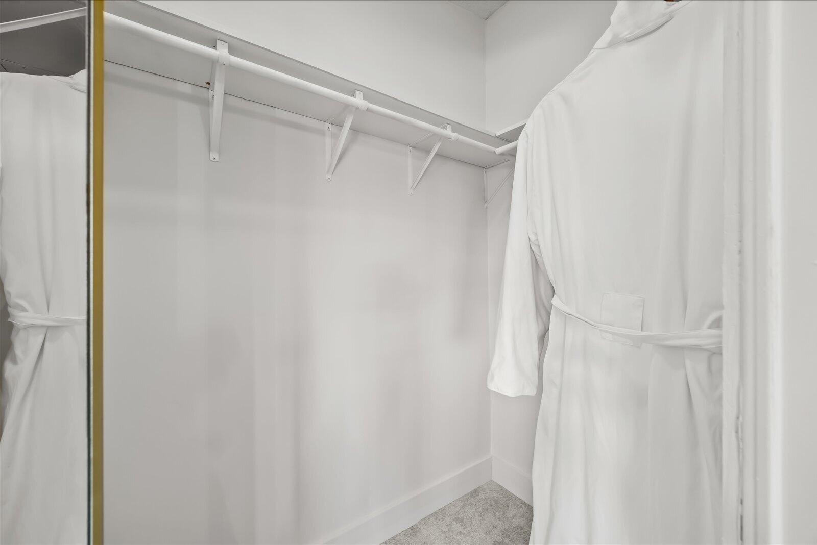 7918 Southeast Paradise Court Stuart, FL 34997 - Photo 26 of 29 a bathroom with a glass shower door
