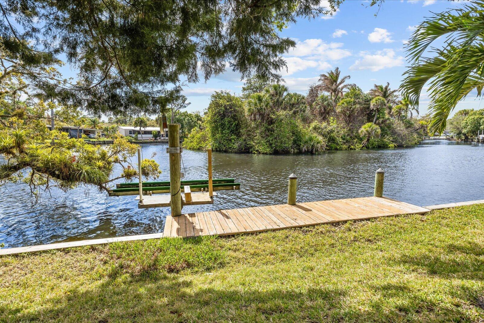 7918 Southeast Paradise Court Stuart, FL 34997 - Photo 4 of 29 a view of a yard with an outdoor space
