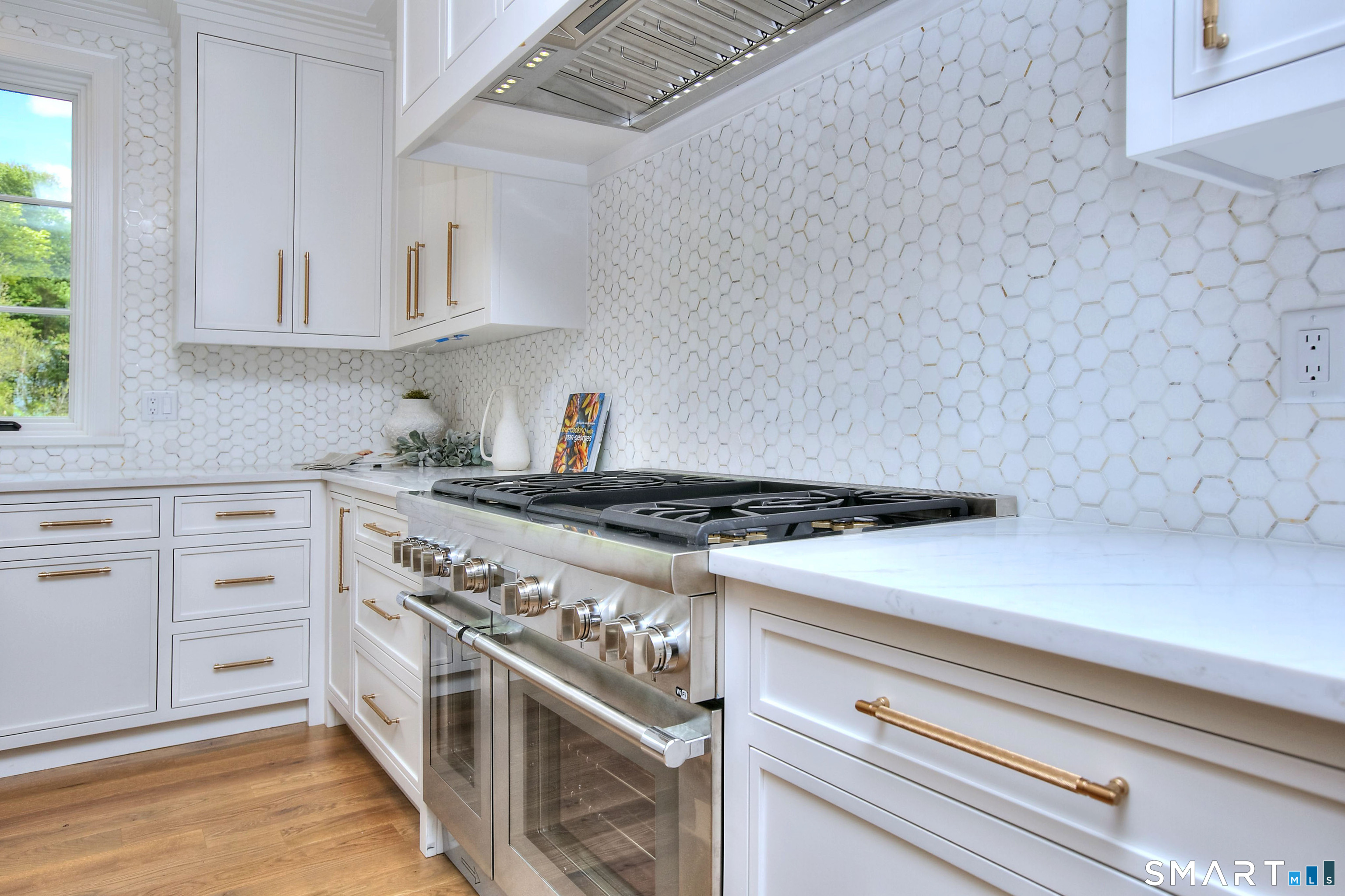 48 Kettle Creek Road Weston, CT 06883 - Photo 11 of 40 a white stove top oven sitting inside of a kitchen