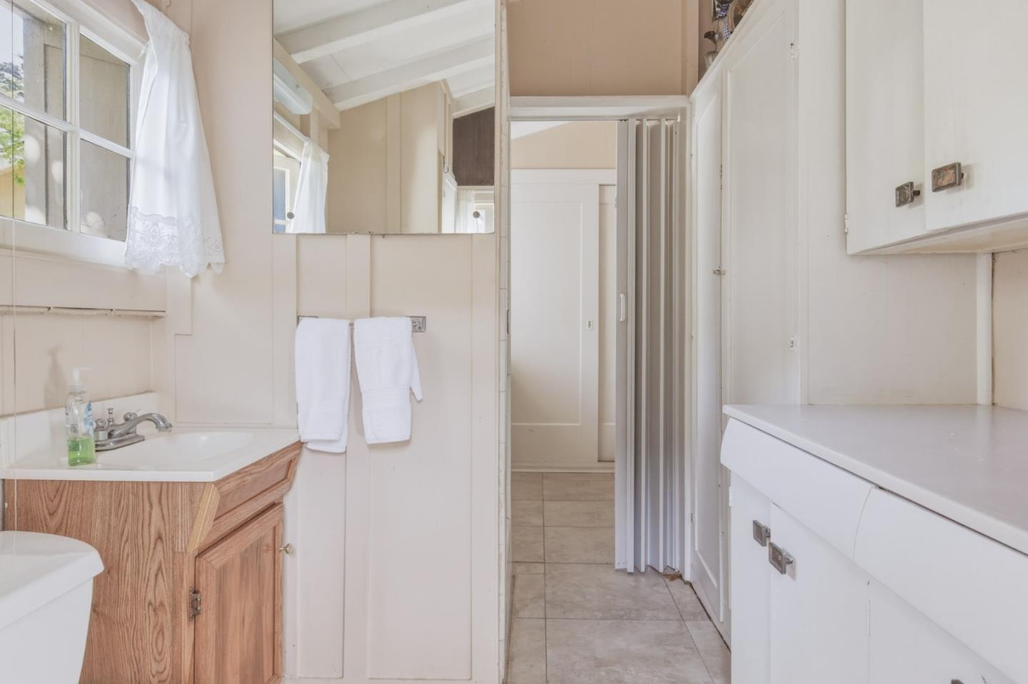 25286 Hatton Road Carmel, CA 93923 - Photo 32 of 34 a bathroom with a sink vanity and tub