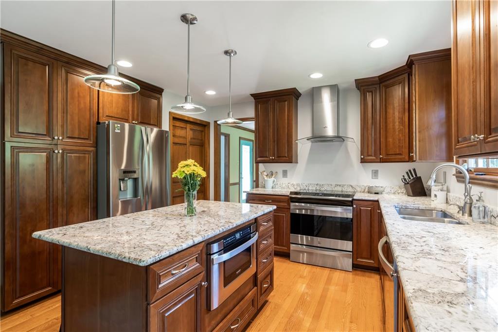 10514 Meinert Road Wexford, PA 15090 - Photo 7 of 20 Updated kitchen boasts an ABUNDANCE of storage. Enjoy your stainless steel appliances, hidden microwave drawer and granite countertops. All new lighting and clean as a whistle!