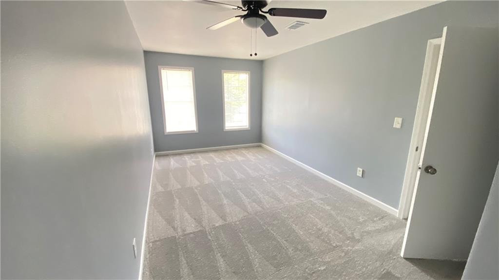 3791 Reston Lane Decatur, GA 30034 - Photo 17 of 20 a view of an empty room with a ceiling fan